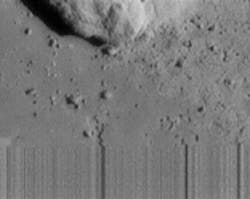 Last image taken by the spacecraft as it landed reveals a unique feature never before seen. The streaky lines at the bottom, taken at a range of 120 m, indicate loss of signal as the spacecraft touched down on the asteroid during transmission. Just to the left of center at the bottom of the image is an apparent collapse feature the size of one&apos;s hand, formed when support is removed from beneath the surface.