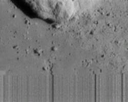 Last image taken by the spacecraft as it landed reveals a unique feature never before seen. The streaky lines at the bottom, taken at a range of 120 m, indicate loss of signal as the spacecraft touched down on the asteroid during transmission. Just to the left of center at the bottom of the image is an apparent collapse feature the size of one's hand, formed when support is removed from beneath the surface. Last image taken by the spacecraft as it landed reveals a unique feature never before seen. The streaky lines at the bottom, taken at a range of 120 m, indicate loss of signal as the spacecraft touched down on the asteroid during transmission. Just to the left of center at the bottom of the image is an apparent collapse feature the size of one's hand, formed when support is removed from beneath the surface.