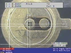 FIGURE 2. The bonder operator uses images/patterns from its video image marker to line up the VCSEL to the target bond site on the TO header. The video image marker is also used to enhance precision during die pickup out of the die carrier. It calibrates in metric units or inches and the measurements are displayed on the screen of the bonder's color monitor. FIGURE 2. The bonder operator uses images/patterns from its video image marker to line up the VCSEL to the target bond site on the TO header. The video image marker is also used to enhance precision during die pickup out of the die carrier. It calibrates in metric units or inches and the measurements are displayed on the screen of the bonder's color monitor.