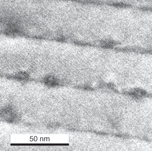 FIGURE 1. A cross-sectional bright-field transmission-electron-microscopy image can reveal multiple, self-assembled indium arsenide quantum-dot layers embedded in gallium arsenide barriers.