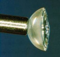 A 1.45-NA solid-immersion lens is the last element in a near-field optical-disc objective. The lens is 2 mm in diameter and 1 mm thick. An air-gap servo system controls the 40-nm gap between lens and disc without overshoot. A 1.45-NA solid-immersion lens is the last element in a near-field optical-disc objective. The lens is 2 mm in diameter and 1 mm thick. An air-gap servo system controls the 40-nm gap between lens and disc without overshoot.