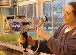 During testing at the Chicago Botanic Garden, a prototype diffuse-reflection sensor developed by Steve Finkelman (pictured) of Containerless Research and researchers from Chicago Botanic Garden and the University of Illinois revealed the total chlorophyll content and relative amounts of the various types of chlorophyll molecules in corn plants, differentiating among the types of chlorophyll molecules to reveal nitrogen-dependent plant health information. During testing at the Chicago Botanic Garden, a prototype diffuse-reflection sensor developed by Steve Finkelman (pictured) of Containerless Research and researchers from Chicago Botanic Garden and the University of Illinois revealed the total chlorophyll content and relative amounts of the various types of chlorophyll molecules in corn plants, differentiating among the types of chlorophyll molecules to reveal nitrogen-dependent plant health information.