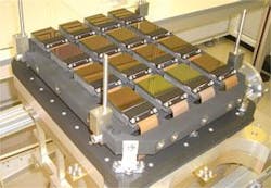 FIGURE 4. Sixteen 2048 × 2048 HgCdTe SCAs were assembled for the VISTA telescope. The SCAs are attached to a precision ground plate that ensures that all pixels are within 12 µm of the desired focus. The detectors are ready to be placed in the telescope camera’s vacuum chamber and cooled to 72 K. FIGURE 4. Sixteen 2048 × 2048 HgCdTe SCAs were assembled for the VISTA telescope. The SCAs are attached to a precision ground plate that ensures that all pixels are within 12 µm of the desired focus. The detectors are ready to be placed in the telescope camera’s vacuum chamber and cooled to 72 K.