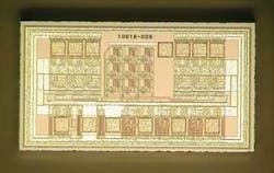 FIGURE 1. A 3 &times; 3 array of photon counters is integrated on one silicon chip. The squares around the chip are the bonding pads.