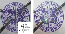 The seal of the Technical University of Braunschweig is seen through a transparent OLED device containing 10 pixels, one of them electrically connected in the power-off state (left) and switched on (right).