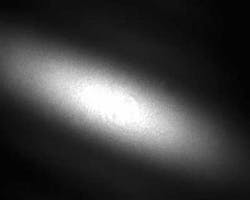 The resulting anamorphic transition adiabatically converts a circular to an elliptical mode (far-field output at 1550 nm is shown at bottom). The resulting anamorphic transition adiabatically converts a circular to an elliptical mode (far-field output at 1550 nm is shown at bottom).