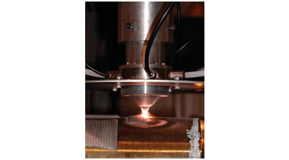 FIGURE 1. A new cladding process developed at the Fraunhofer Center for Surface and Laser Processing utilizes a 3 kW direct diode laser and a coaxial powder-feeding nozzle.