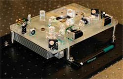 FIGURE 3. A terahertz-TDS system developed at Rensselaer Polytechnic Institute is 7 × 10 × 3.5 in. and weighs less than 10 lb (above). It utilizes a compact IMRA (Ann Arbor, MI) fiber laser (780 nm, less than 100 fs, 50 MHz, 20 mW), biased photoconductive GaAs antenna (100 µm photoconductive gap with 200 V bias at 50 kHz), ZnTe balanced detection and a fast linear translation stage. The lock-in time constant, waveform acquisition speed, and scan length are 1 ms, 2 Hz, and 100 ps, respectively; SNR exceeds 10,000 at around 0.8 THz. FIGURE 3. A terahertz-TDS system developed at Rensselaer Polytechnic Institute is 7 × 10 × 3.5 in. and weighs less than 10 lb (above). It utilizes a compact IMRA (Ann Arbor, MI) fiber laser (780 nm, less than 100 fs, 50 MHz, 20 mW), biased photoconductive GaAs antenna (100 µm photoconductive gap with 200 V bias at 50 kHz), ZnTe balanced detection and a fast linear translation stage. The lock-in time constant, waveform acquisition speed, and scan length are 1 ms, 2 Hz, and 100 ps, respectively; SNR exceeds 10,000 at around 0.8 THz.