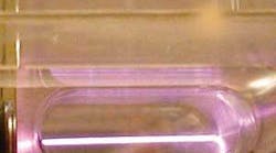 A 40 TW Ti:sapphire laser beam accelerates electrons in plasma within a capillary tube.