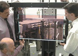 FIGURE 2. Purple color in laser slab with edge cladding, ready for mounting in a NIF laser, is due to the neodymium ion. The ion is the active laser ion in the phosphate glass host. Slab is approximately 80 x 44 x 4 cm3. FIGURE 2. Purple color in laser slab with edge cladding, ready for mounting in a NIF laser, is due to the neodymium ion. The ion is the active laser ion in the phosphate glass host. Slab is approximately 80 x 44 x 4 cm3.