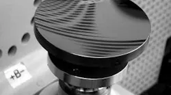 FIGURE 1. Aspheric subaperture-stitching interferometry can be used to measure the surface figures of aspheres such as this ellipsoid (conic), which has a 100 mm aperture diameter, a base radius of -226 mm, and approximately 12 µm of aspheric departure. The asphere is fabricated from lightweighted silicon carbide with silicon cladding.