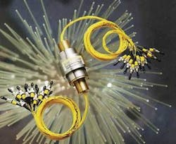 FIGURE 3. For deep-sea cables deploying to industrial robots, rotating camera pedestals, and remotely operated vehicles and submarine sensor platforms, Schleifring (Fürstenfeldbruck, Germany) has developed a fiber array with a rotating joint. A bundle of 16 to 64 fibers is collimated by a microlens array. The light propagates toward a second microlens array, which is rotating. A dove prism located midway between the sender and receiver array rotates at half speed and guides each light beam of the static array to its corresponding lens of the rotating array. This fiber connector allows the transmission of more than 10 Gbit/s per channel at typically less than 2 dB loss in rotary joints rotating at 100 rpm. FIGURE 3. For deep-sea cables deploying to industrial robots, rotating camera pedestals, and remotely operated vehicles and submarine sensor platforms, Schleifring (Fürstenfeldbruck, Germany) has developed a fiber array with a rotating joint. A bundle of 16 to 64 fibers is collimated by a microlens array. The light propagates toward a second microlens array, which is rotating. A dove prism located midway between the sender and receiver array rotates at half speed and guides each light beam of the static array to its corresponding lens of the rotating array. This fiber connector allows the transmission of more than 10 Gbit/s per channel at typically less than 2 dB loss in rotary joints rotating at 100 rpm.
