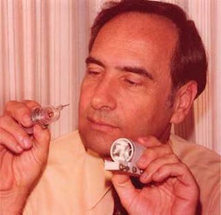 Theodore Maiman, with a ruby laser on the laser&rsquo;s 25th anniversary.