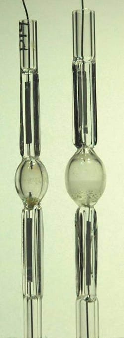 FIGURE 2. Highly efficient extraction of light from HID sources required redesign of the arc chamber and arc-chamber materials to operate in ambient air without succumbing to oxidation. The larger arc chamber on the right is currently in use; the one on the left is under development. FIGURE 2. Highly efficient extraction of light from HID sources required redesign of the arc chamber and arc-chamber materials to operate in ambient air without succumbing to oxidation. The larger arc chamber on the right is currently in use; the one on the left is under development.
