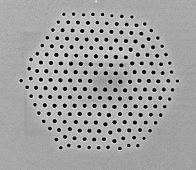 FIGURE 1. A silica microstructured optical fiber fabricated at the University of Southampton Optoelectronics Research Centre demonstrates the flexibility of sizes and arrangement of holes that can be fabricated in a single fiber.