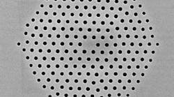 FIGURE 1. A silica microstructured optical fiber fabricated at the University of Southampton Optoelectronics Research Centre demonstrates the flexibility of sizes and arrangement of holes that can be fabricated in a single fiber.