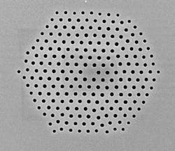 FIGURE 1. A silica microstructured optical fiber fabricated at the University of Southampton Optoelectronics Research Centre demonstrates the flexibility of sizes and arrangement of holes that can be fabricated in a single fiber.