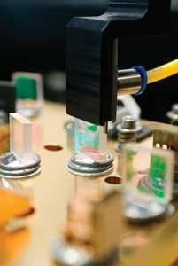 FIGURE 1. With PermAlign technology, each optic in a diode-pumped solid-state laser cavity is rigidly soldered to a ceramic base. FIGURE 1. With PermAlign technology, each optic in a diode-pumped solid-state laser cavity is rigidly soldered to a ceramic base.