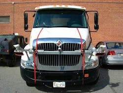 The NIST measurement system is strapped on the hood of a truck to test the crash warning system hidden inside the grill and windshield. The laser scanners are housed in the circular, red enclosures at the corners. The NIST measurement system is strapped on the hood of a truck to test the crash warning system hidden inside the grill and windshield. The laser scanners are housed in the circular, red enclosures at the corners.