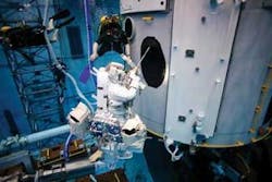 FIGURE 3. Astronauts train for replacing Hubble&rsquo;s gyroscopes using special tools in a buoyancy tank that simulates the effects of weightlessness and working in a space suit.