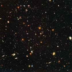 FIGURE 4. The Hubble Ultra Deep Field includes a view of nearly 10,000 galaxies. The smallest, reddest galaxies may be among the most distant known, existing when the universe was just about 800 million years old. The nearest galaxies - the larger, brighter, well-defined spirals and ellipticals - thrived about 1 billion years ago, when the cosmos was 13 billion years old. The image required 800 exposures taken over the course of 400 Hubble orbits around Earth.