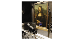 FIGURE 1. A high-resolution 3-D color laser scanner mounted on a translation stage was used to scan the Mona Lisa. The scanner uses red, green, and blue wavelengths as the laser source, which, when superimposed in the scanning system, results in the projection of a white, 50- to 100-&micro;m-diameter laser spot on the object.