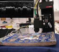 FIGURE 3. Researchers from the British Museum used OCT to image a Persian-glazed tile. The inset shows the OCT image of the glaze layer, illustrating the variable thickness of the glaze layer over the different body colors and striations in the glaze layer to the right. FIGURE 3. Researchers from the British Museum used OCT to image a Persian-glazed tile. The inset shows the OCT image of the glaze layer, illustrating the variable thickness of the glaze layer over the different body colors and striations in the glaze layer to the right.