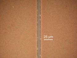 FIGURE 3. An ultrafast UV hybrid fiber laser can remove and pattern thin films of indium tin oxide (ITO) with processing speeds of 25 m/s (left). The sample shows straight walls with no signs of pulse overlapping as is often obvious with nanosecond lasers, and the bottom of the line is flat and there is no damage to the glass carrier (right).