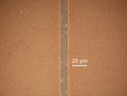 FIGURE 3. An ultrafast UV hybrid fiber laser can remove and pattern thin films of indium tin oxide (ITO) with processing speeds of 25 m/s (left). The sample shows straight walls with no signs of pulse overlapping as is often obvious with nanosecond lasers, and the bottom of the line is flat and there is no damage to the glass carrier (right). FIGURE 3. An ultrafast UV hybrid fiber laser can remove and pattern thin films of indium tin oxide (ITO) with processing speeds of 25 m/s (left). The sample shows straight walls with no signs of pulse overlapping as is often obvious with nanosecond lasers, and the bottom of the line is flat and there is no damage to the glass carrier (right).