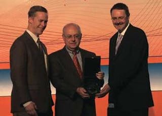 Steve Anderson, Laser Focus World editor-in-chief and associate publisher (center), presents the 2008 PhAST/Laser Focus World Innovation Award to Andrew Masters (right), a director of marketing at Coherent, for Coherent&rsquo;s OPSL-577-3, an optically pumped semiconductor laser at 577 nm targeted for the treatment of age-related macular degeneration, as David Huff, vice president of marketing and business development for the Optoelectronics Industry Development Association, looks on. To view video interviews with award recipients, see www.laserfocusworld.com/resourcecenter/video.html.
