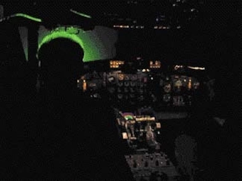 Laser illumination in a dark cockpit at 50-&micro;W/cm2 shows up from the rear as a green halo around subject&apos;s head.