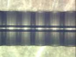 A hollow-core fiber with 10-µm modulations facilitates quasi-phase-matching to generate EUV light. A hollow-core fiber with 10-µm modulations facilitates quasi-phase-matching to generate EUV light.