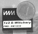 FIGURE 2. Prototype of a stackable 1 x 2 fiber switch for single-mode applications has an insertion loss at 1300 nm of 0.6 dB. FIGURE 2. Prototype of a stackable 1 x 2 fiber switch for single-mode applications has an insertion loss at 1300 nm of 0.6 dB.