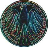 FIGURE 1. The national side of a Euro coin—illuminated by red, green, and blue LEDs (image colors inverted)—is specific to each country. FIGURE 1. The national side of a Euro coin—illuminated by red, green, and blue LEDs (image colors inverted)—is specific to each country.