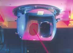 FIGURE 2. A laser transmitter can be mounted on an aircraft to fire a beam at a surface-to-air missile targeted at the plane. The transmitter module is mounted on a surface that gives it a clear line of sight to missiles fired at the plane. Sensors mounted on the plane track the missile; multiple laser transmitters can be mounted on the plane to give more coverage. FIGURE 2. A laser transmitter can be mounted on an aircraft to fire a beam at a surface-to-air missile targeted at the plane. The transmitter module is mounted on a surface that gives it a clear line of sight to missiles fired at the plane. Sensors mounted on the plane track the missile; multiple laser transmitters can be mounted on the plane to give more coverage.