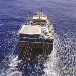 FIGURE 2. The data from fiber sensors searching for submarine oil fields is as good or better than the data from conventional electronic sensors. The most costly portion of these electrical systems, however, is in the water—where gear is at higher risk. Optical sensors, on the other hand, keep their most expensive components shipboard and probe the depths with relatively inexpensive optical fiber. FIGURE 2. The data from fiber sensors searching for submarine oil fields is as good or better than the data from conventional electronic sensors. The most costly portion of these electrical systems, however, is in the water—where gear is at higher risk. Optical sensors, on the other hand, keep their most expensive components shipboard and probe the depths with relatively inexpensive optical fiber.