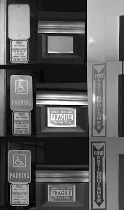 FIGURE 3. Rows of pictures are taken with an InGaAs SWIR camera (top), an InGaAs visible-SWIR camera (center), and a visible camera (bottom). Only black lettering shows up in the SWIR imagery. The blue and red lettering used in most of the warning signs can be seen with the visible-SWIR camera, but not with the SWIR-only camera. FIGURE 3. Rows of pictures are taken with an InGaAs SWIR camera (top), an InGaAs visible-SWIR camera (center), and a visible camera (bottom). Only black lettering shows up in the SWIR imagery. The blue and red lettering used in most of the warning signs can be seen with the visible-SWIR camera, but not with the SWIR-only camera.