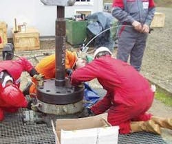 Optical-fiber sensors, such as this system being installed in an oil well, are often used to determine temperature, pressure, and other properties in down-hole environments. A carbon coating protects the fiber from high-partial-pressure molecular hydrogen, which darkens fiber.