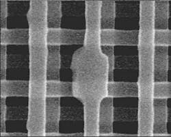 FIGURE 1. A 0.3-µm2 defect in a 3-D multiple-quantum-well photonic crystal serves as a cavity that emits 1550-nm light. FIGURE 1. A 0.3-µm2 defect in a 3-D multiple-quantum-well photonic crystal serves as a cavity that emits 1550-nm light.