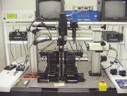 FIGURE 1. A motor-actuated workstation is used to test a fiberoptic-alignment scheme. One fiber array is placed on the fixed middle post, while the other fiber array is put on the left stage. The resolution of the stage’s lateral movement is 50 nm. Two CCD cameras, one on the top, one on the back, are connected to the monitor to help the operator manually adjust the devices into a roughly aligned position. FIGURE 1. A motor-actuated workstation is used to test a fiberoptic-alignment scheme. One fiber array is placed on the fixed middle post, while the other fiber array is put on the left stage. The resolution of the stage’s lateral movement is 50 nm. Two CCD cameras, one on the top, one on the back, are connected to the monitor to help the operator manually adjust the devices into a roughly aligned position.