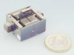 FIGURE 3. High-force, nonmagnetic linear piezo drives can generate thrust to 600 N. The fast &shy;response (in this device shown next to a euro coin) is typically less than 10 ms, enabling dynamic &shy;operation, such as continuous dithering or active vibration cancellation.