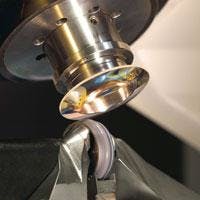 FIGURE 3. Magnetorheological finishing can be used to correct and smooth a finished asphere. FIGURE 3. Magnetorheological finishing can be used to correct and smooth a finished asphere.