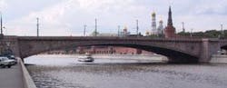 FIGURE 1. The Bolshoi Moskvoretsky Bridge in Moscow, built between 1936 and 1937 near the Kremlin, is part of one of the city&apos;s major traffic lines. The bridge consists of three parallel, 100-m-long, reinforced-concrete arches hidden -behind stone walls. Two types of degradation have been detected: settlement in the -center of the arch, which caused cracking of the stone walls near the abutments on both sides of the bridge, and chloride diffusion transversing the upper wall of the arch -boxes. In 2003, 16 interferometric sensors (produced by Smartec) were installed to -continuously monitor structural behavior of the bridge, increase safety, and reduce maintenance costs.