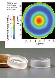 FIGURE 1. Glass lenses for a mobile-phone camera (bottom) often exhibit high distortion, as indicated by a digital color-coded map (shown corrected for tilt and focus errors) of the wavefront distortion in transmission (top; up to -10ë in the blue and more than +30ë in the red regions of the map). However, several lenses can be combined to complement each other optically, and the whole system will sum to give minimal optical distortion. FIGURE 1. Glass lenses for a mobile-phone camera (bottom) often exhibit high distortion, as indicated by a digital color-coded map (shown corrected for tilt and focus errors) of the wavefront distortion in transmission (top; up to -10ë in the blue and more than +30ë in the red regions of the map). However, several lenses can be combined to complement each other optically, and the whole system will sum to give minimal optical distortion.