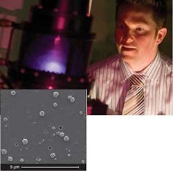 Materials Engineer David Simpson from Quantum Communications Victoria (QCV) observes the growth of diamond nanocrystals in a microwave plasma-enhanced chemical-vapor-deposition reactor. A patented technique for optical pumping of single-atom nitrogen defects in the diamond nanocrystals (inset) creates an excited state that generates single-photon emission at 700 nm, allowing show-floor operation of QCV’s newly released SPS 1.01 single-photon source. Materials Engineer David Simpson from Quantum Communications Victoria (QCV) observes the growth of diamond nanocrystals in a microwave plasma-enhanced chemical-vapor-deposition reactor. A patented technique for optical pumping of single-atom nitrogen defects in the diamond nanocrystals (inset) creates an excited state that generates single-photon emission at 700 nm, allowing show-floor operation of QCV’s newly released SPS 1.01 single-photon source.