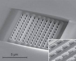 FIGURE 2. One face of a metamaterial prism reveals its fishnet structure. The prism has a refractive index of -1.35 at a 1.775 &micro;m wavelength. The metamaterial consists of alternating layers of metal and dielectric (inset).