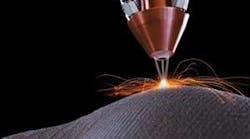FIGURE 1. For laser cladding applications, powder blown through a nozzle or nozzles is sintered using heat from the central laser beam.