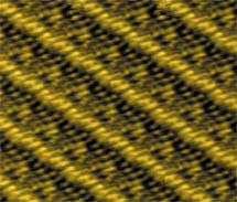 Liquid-crystal molecules align on a sheet of graphite in a scanning tunneling microscope image. Experiments show that the molecules can crystallize even above the usual 'melting' temperature if they are placed in a narrow space between two surfaces.