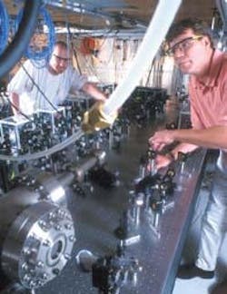 Researchers Murray Barrett (left) and Michael Chapman adjust the optics of lasers used to cool and confine Bose-Einstein condensates in their lab. Researchers Murray Barrett (left) and Michael Chapman adjust the optics of lasers used to cool and confine Bose-Einstein condensates in their lab.