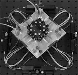An X-cube containing four cemented rooftop prisms is at the heart of a 4 x 4 optical star-coupler module. An X-cube containing four cemented rooftop prisms is at the heart of a 4 x 4 optical star-coupler module.